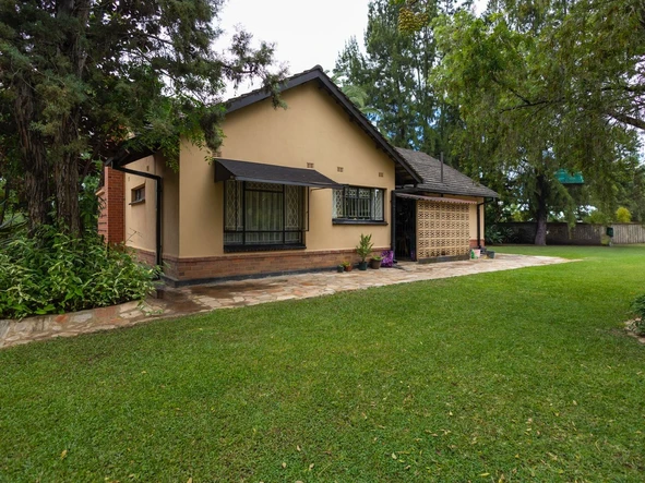  Executive 3 bedroomed house on spacious land with a mature garden and a perennial borehole. 