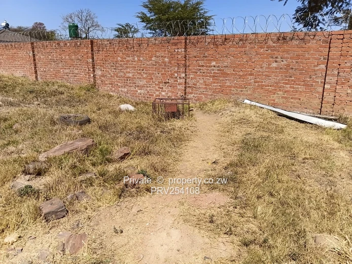 5-Bed Home with Brick Wall & Metal Gate in Pomona