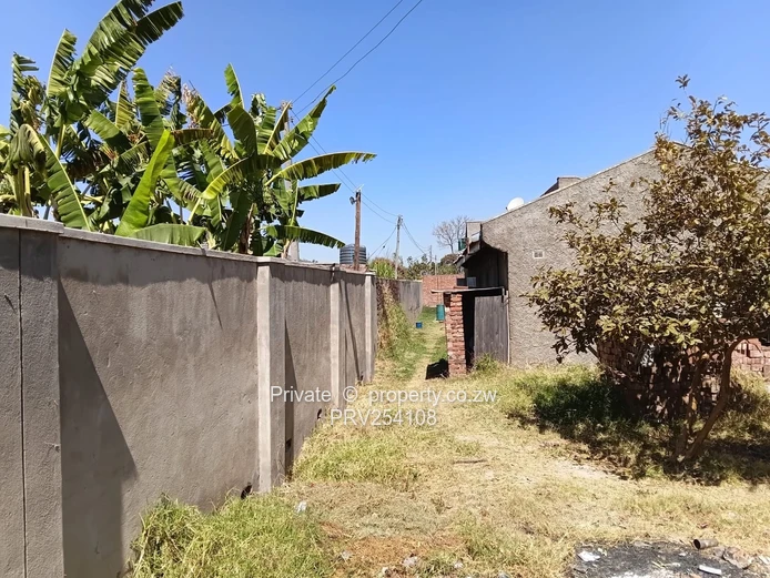 5-Bed Home with Brick Wall & Metal Gate in Pomona