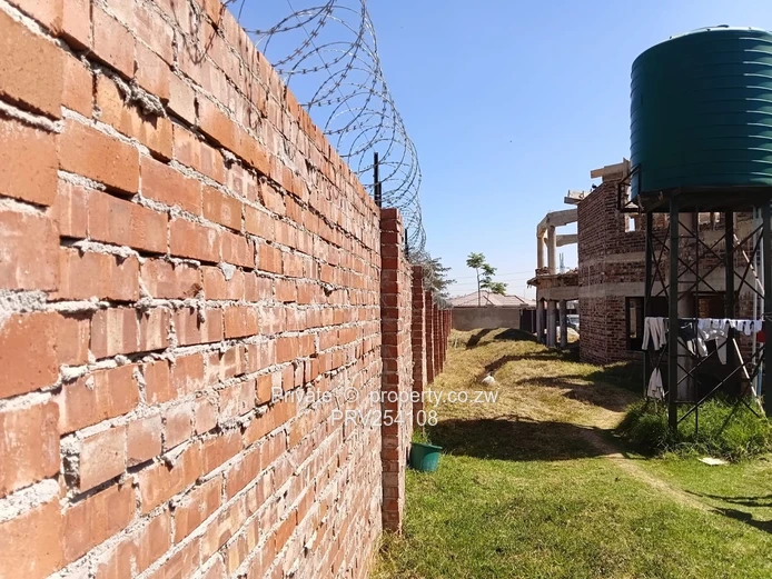 5-Bed Home with Brick Wall & Metal Gate in Pomona