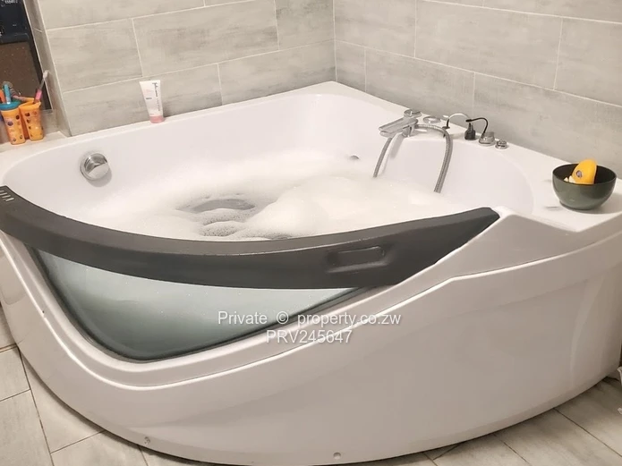 Modern 4-bed turnkey home on large 1,150m² stand near Sunway City. Full solar, borehole, jacuzzi, el
